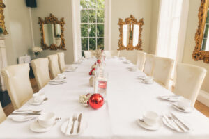 dining table set up with a christmas theme