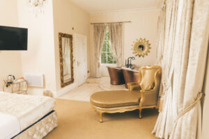 bedroom with golden sofa