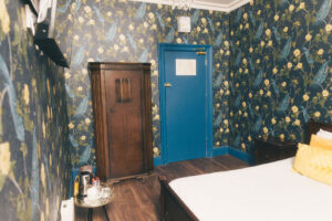 wardrobe and bed in hotel room