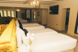 multiple beds in large hotel bedroom