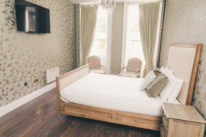 Bedroom at rainhill hall with tv