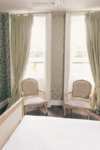 2 chairs next to windows