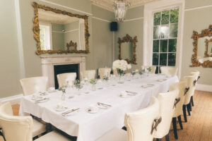 Dining area with table set for guests at rainhill hall