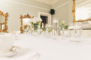 glasses filled with water and flowers